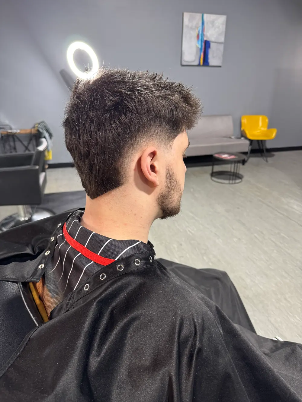 Precision haircut with a clean fade